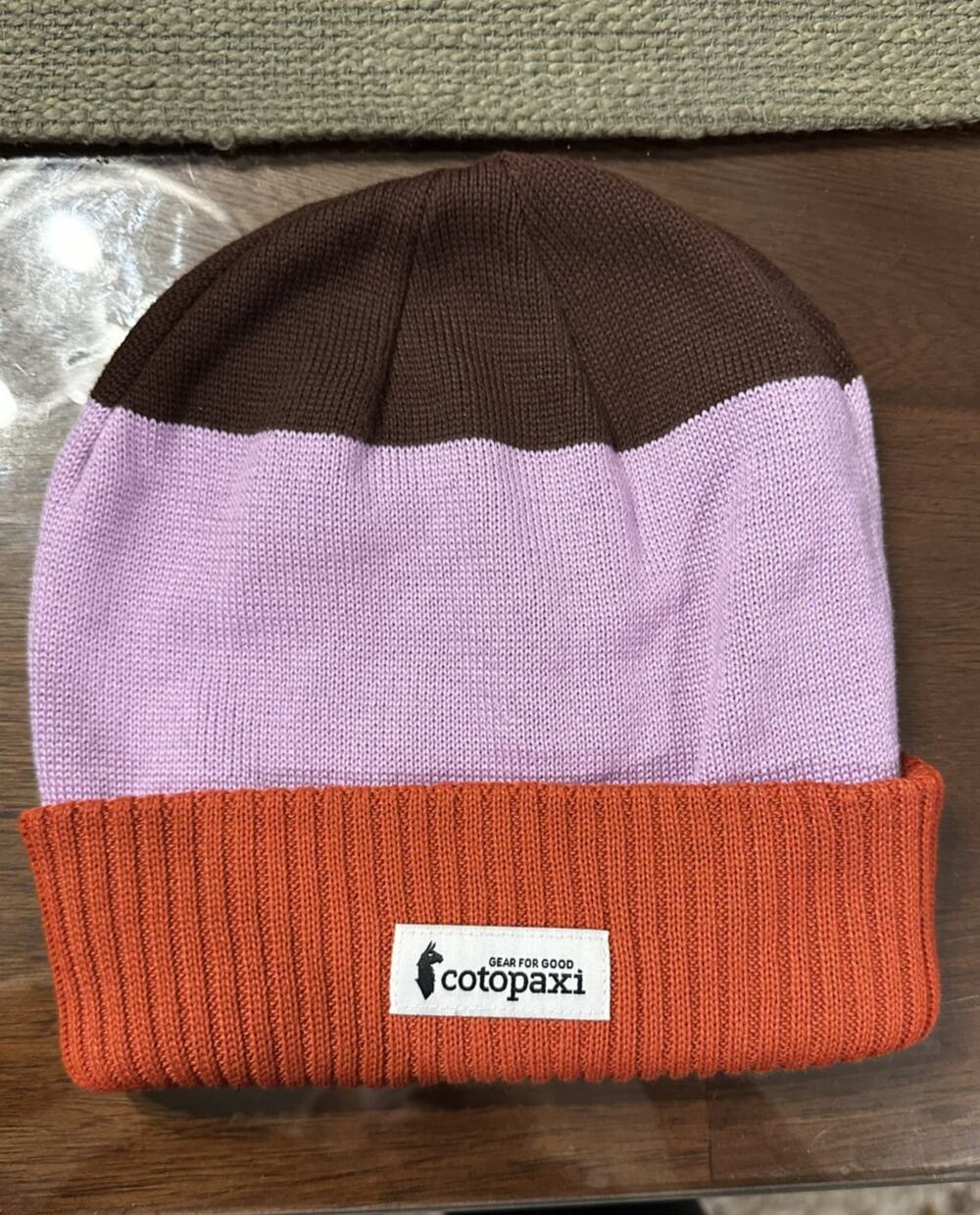 Cotopaxi orange, purple, and brown toboggan/beanie